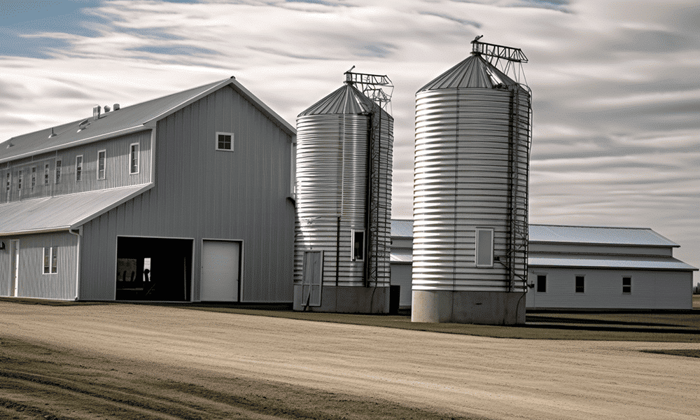 "Modern multi-purpose steel farm building in a rural setting, showing different shades of steel"