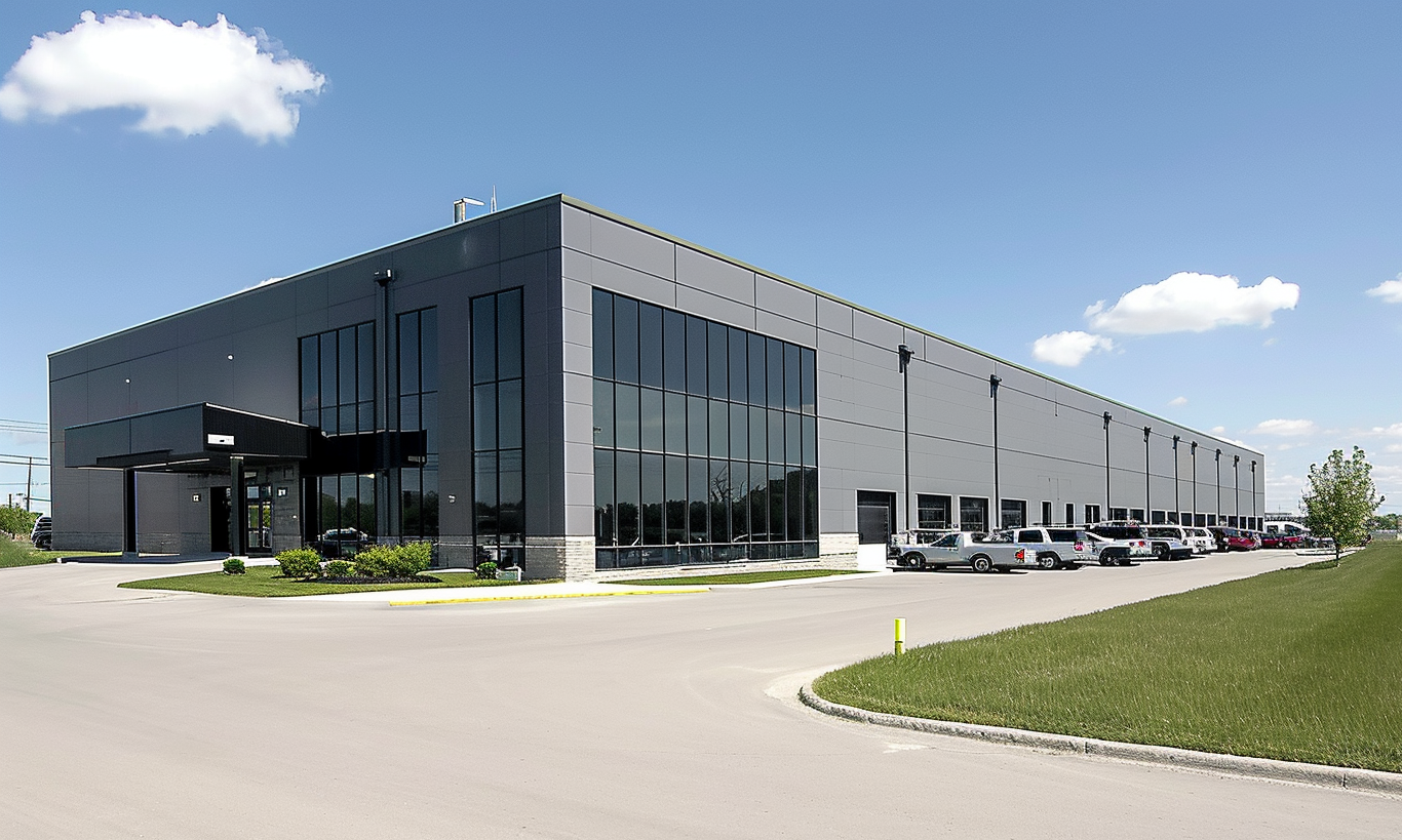 "Wide view of a spacious car park at an Ontario warehouse during daylight"